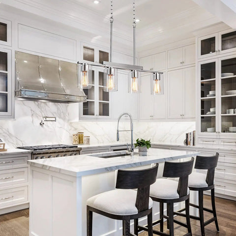 4 Light Linear Kitchen Island Pendant Light With Clear Glass Shades, Brushed Nickel Chandelier over modern farmhouse kitchen island.