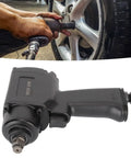 Person using Extra Heavy Duty Half Inch Air Impact Wrench Nut Busting Pneumatic Impact Gun on vehicle wheel.