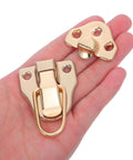 Vintage Golden Metal Box Toggle Latch With Padlock Hole Fits Wood Cases And Guitar Boxes Featuring Easy Install Duckbill Hasp shown in hand