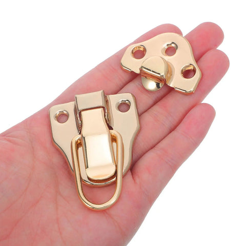 Vintage Golden Metal Box Toggle Latch With Padlock Hole Fits Wood Cases And Guitar Boxes Featuring Easy Install Duckbill Hasp shown in hand