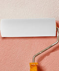 Twelve Pack Nifty Little Mini Sponge Rollers With Cushioned Handles For Walls And Detail Work Gives You A Straight Up Flawless Coat Every Time Super Simple Cleanup Built Solid For Daily Hustle roller in use on a painted wall.