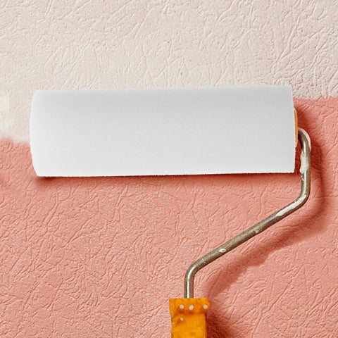 Twelve Pack Nifty Little Mini Sponge Rollers With Cushioned Handles For Walls And Detail Work Gives You A Straight Up Flawless Coat Every Time Super Simple Cleanup Built Solid For Daily Hustle roller in use on a painted wall.