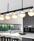 32 Inch Wide Modern LED Kitchen Island Pendant Light Five Light Kit Adjustable Height Dimmable 3000K Warm White Black And Gold Finish Chandeliers For Kitchen Island And Dining Room in a modern kitchen setting.