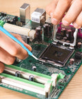 Person using Five Piece Ceramic Insulated Screwdriver Set For Precision Electronics Repair And Watchmaking on a circuit board.