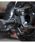 Close-up of Chrysler Harmonic Damper Puller and Balancer Removal Tool Set for Mechanics in use on vehicle engine