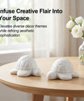 Top Shelf White Ceramic Sea Turtle Toilet Bolt Covers 2 Piece Set Fresh Coastal Bathroom Decor on wooden table.
