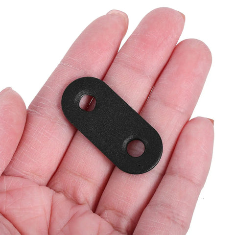 Flat Straight Brackets Set Of 12 Stainless Steel Black Mending Plates in hand showing size and design with predrilled holes