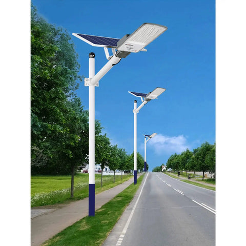 Hella Bright 200 Watt Solar Outdoor Flood Lights With Remote Control And Dusk To Dawn Sensor IP65 Waterproof Garden Yard Lamps For Fence Pathway Zero Hassle Install mounted along a tree-lined road.