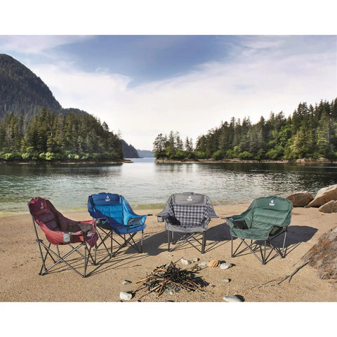 Four camping chairs on a scenic lake beach; green chair is an Oversized Extra Large Padded Camping Chair Portable Folding Lounge With Cup Holder.