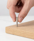 Inserting a screw from Heavy Duty Cabinet Shelf Peg Set With 150 Self Tapping Screws And 150 Sleeves for cabinets.