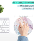 Pink Marble Round Mouse Pad With Premium Textured Surface, Washable And Non Slip Rubber Base, 7.87 By 7.87 Inches, 3 mm Thick Desktop Protector For Work And Gaming, Durable Stitched Edges, Customizable Design next to keyboard