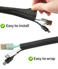 Hands inserting cables into Split Wire Loom One Half Inch 50 Feet Braided Cable Sleeve For Cable Management And Pet Safe Protection, Black.