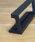 Top Shelf Angled Stand For AK2515 Audio Spectrum Analyzer black metal holder on wooden surface for custom display.