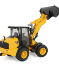 Cat Wheel Loader 1 To 16 Scale Model with articulated steering and fully functional loading arm raised, black shovel attached.