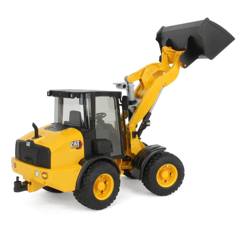 Cat Wheel Loader 1 To 16 Scale Model with articulated steering and fully functional loading arm raised, black shovel attached.