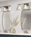 Bathroom setting with Mid Century Wall Light Fixture With Three Lights Dope Sleek Vintage Brass Vanity Light and mirrors.