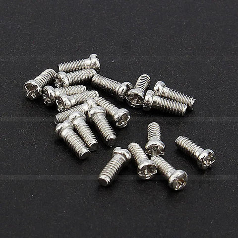 Precision Crafted Micro Stainless Steel Screws For Professional Watch Repairs And Antique Clock Restoration Hella Durable Tiny Watchmaker Parts Collection on black background.