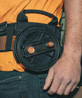 Tie Wire Reel With Quick Lock And Lightweight Aluminum Body, Ambidextrous Rewind Knob, worn on belt by worker
