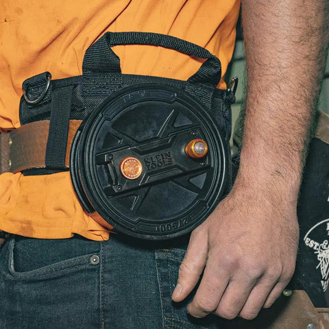 Tie Wire Reel With Quick Lock And Lightweight Aluminum Body, Ambidextrous Rewind Knob, worn on belt by worker