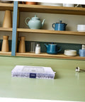 Beefy 300 Piece Stainless Steel Set Screws Kit With Allen Wrenches on kitchen counter with wooden shelves in background