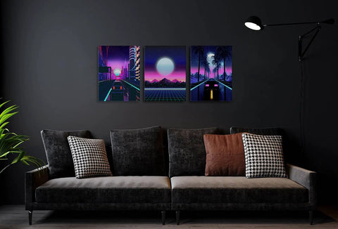 Neon Cyberpunk City Wall Art Set, 3 Panels, 12x16 Inches, Teen Boy Room Decor, Cars Driving Through Neon Suburbs, Retro 80s Inspired Landscape Canvas For Bedroom, Living Room, Or Office displayed above a dark sofa.