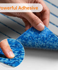 Close-up of hand peeling back Self Adhesive EVA Foam Soft Foam Decking 6mm Grippy Non Slip Marine Decking With Teak Look Finish