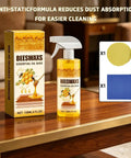 Premium Natural Beeswax Wood Polish Spray That Really Hits Different For Kitchen Cabinets Dining Tables And Hardwood Floors Leaves Surfaces Slick Shiny And Protected on a wooden table with yellow applicators.