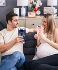Celebrate The Freshly Minted Arrival Of New Mama And Papa With This Awesome Gift Set For Couples Featuring Matching Tumblers Paired With A Warm Cozy Candle Perfect For Baby Showers First Fathers Day And Parenting Squad Celebrations. A couple enjoys matching insulated tumblers at home.