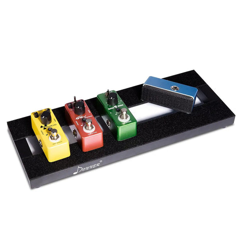 Guitar Pedalboard Mounting Tape 2M Long By 50mm Wide With Hook And Loop holding colorful pedals on a black pedalboard.