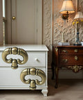 Set Of 2 Antique Bronze Ring Drawer Pulls With Back Plates for cabinets, shown on white and brown furniture in a vintage room setting.