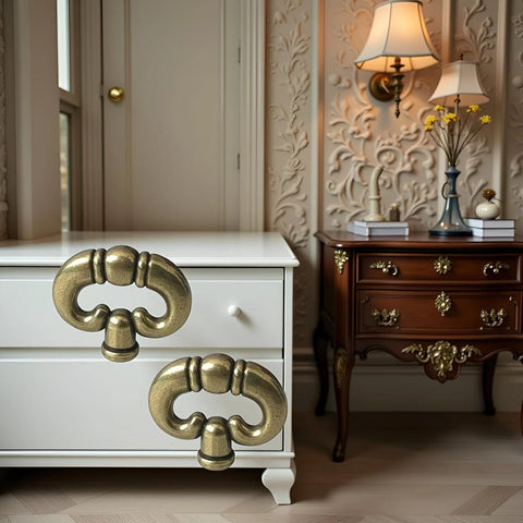 Set Of 2 Antique Bronze Ring Drawer Pulls With Back Plates for cabinets, shown on white and brown furniture in a vintage room setting.