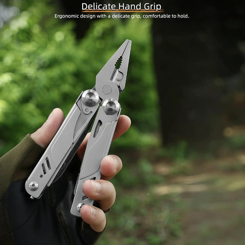 Hand holding Everyday Carry Ready Eighteen In One Stainless Steel Multitool Pliers with ergonomic handle outdoors.