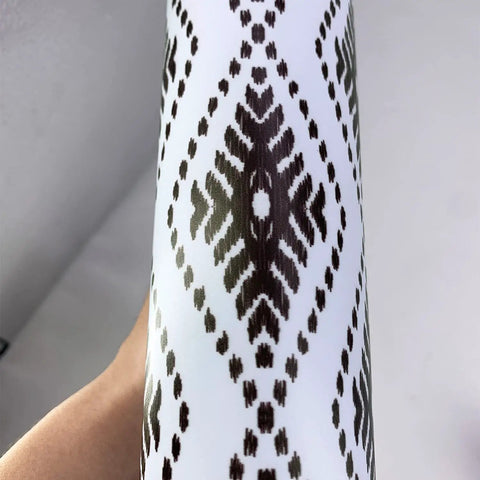 Close-up of rolled 15 Strips Peel And Stick Stair Riser Decals Boho Bohemian Self Adhesive Staircase Stickers in black pattern