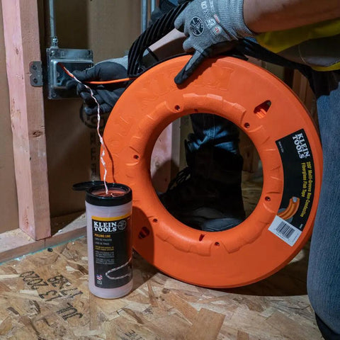No Nonsense Heavy Duty Steel Fish Tape Wire Pulling Kit with orange reel and conduit installation