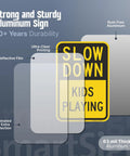 Heavy Duty Slow Down Kids Playing Neighborhood Warning Sign Crafted From Tough 63 Mil Aluminum Equipped With Top Shelf 3M Engineer Grade Reflective Film Guaranteeing Serious Visibility And Hardworking Outdoor Durability, displaying reflective features and solid build.