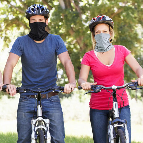 Two cyclists wearing 6 Pack Summer UV Protection Neck Gaiters For Face Covering, Cooling Breathable Bandana Scarves.