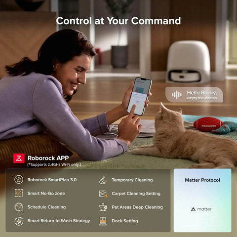 Woman using smartphone to control Qrevo Curv 2 Flow Robot Vacuum And Mop With SpiraFlow Real Time Self Cleaning Mop on carpet.