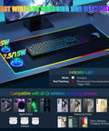 Top view of wireless charging desk pad with built-in mouse pad, RGB lighting, and phone holder on a desk setup.