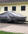 Heavy Duty Reversible Tarp 16 by 20 in Silver Brown, 10 Mil Polyethylene covering a trailer by a yellow building