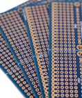 Four piece solderable breadboard shield with split design PCB prototyping board double sided tinned gold plated holes close-up