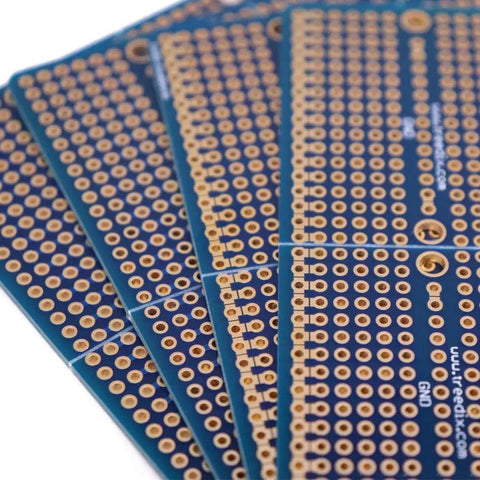 Four piece solderable breadboard shield with split design PCB prototyping board double sided tinned gold plated holes close-up