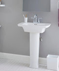 Edgemere Centerset Two Handle Chrome Bathroom Faucet on white sink with brass spout and drip-free performance in bathroom setting.