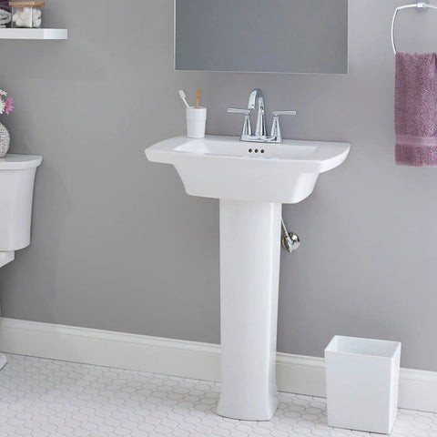 Edgemere Centerset Two Handle Chrome Bathroom Faucet on white sink with brass spout and drip-free performance in bathroom setting.