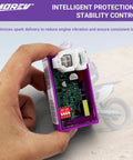 6 Pin DC CDI Ignition Module For GY6 Engines Dual Compatibility With 139QMB 157QMJ Scooters, hand holding module, DIP switch visible.