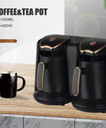 Dual coffee and tea pot set with black and gold design on a wooden countertop, labeled 500+500ml capacity and 600W power.