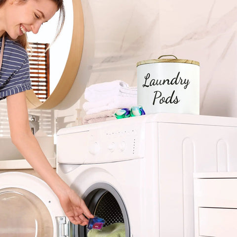 Woman using washer with Wood Laundry Pods Container With Lid For Handy Laundry Room Decor And Storage Pods Holder visible