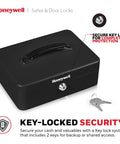 Compact Cash Box With Removable Money Tray And Under Tray Storage Five Coin Slots Durable Metal Safe With Key Lock Ideal For Home Office Black 0.14 Cu Ft Saving Money Lock Box, shown with keys on white background.
