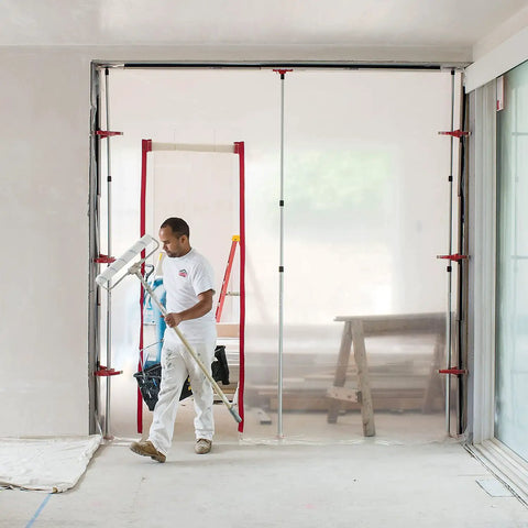 Worker using Heavy Duty Dust Barrier Zipper 2 Pack Self Adhesive Entry Door For Remodeling Jobs Red HDAZ2 Durable Doorway Access