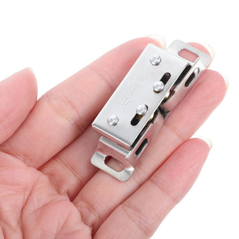 Close-up of Stainless Steel Door Ball Catch Kit With Adjustable Tension Spring Latch in hand, silver finish, for closet doors