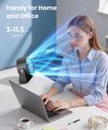 Rechargeable Small Desk Fan With Quiet 35dB Breeze on desk, woman using laptop, blue airflow visible